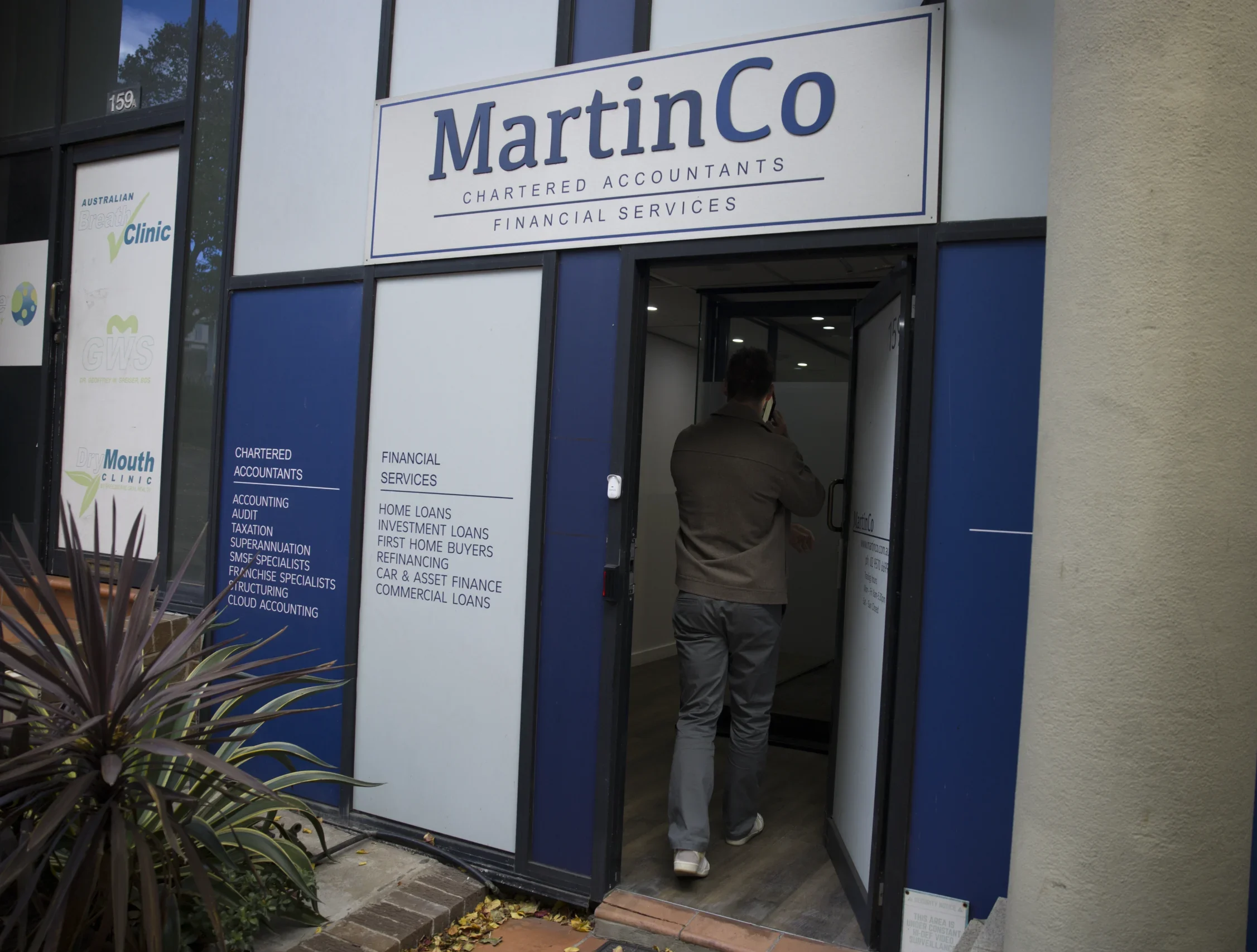 Professional walking into the MartinCo office.